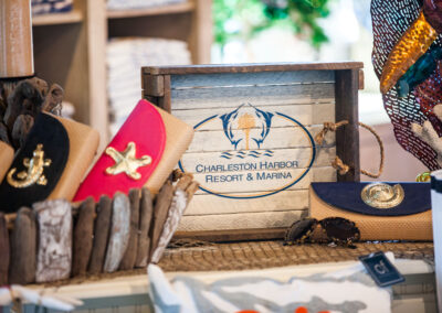 merchandise - wallets and sunglasses and Charleston harbor resort and marina sign.